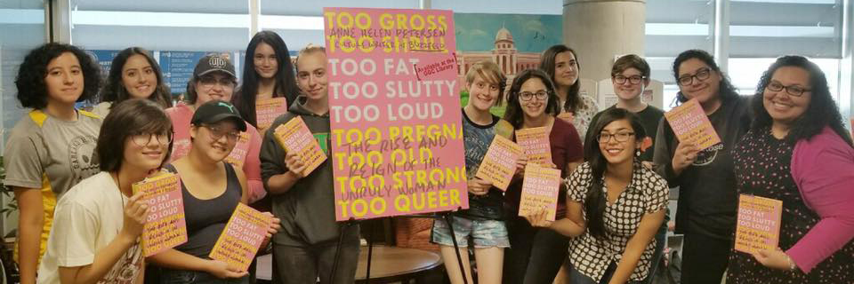 Book Club Students pose with their copies of the book.